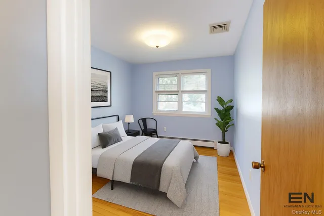 a bed room with a bed and a window