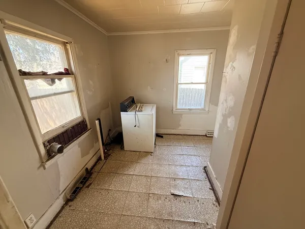a view of an empty room with a window