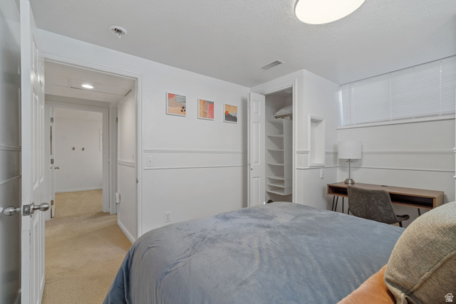 4426 South 3035 East Holladay, UT 84124 - Photo 25 of 49 Bedroom with light carpet and baseboards