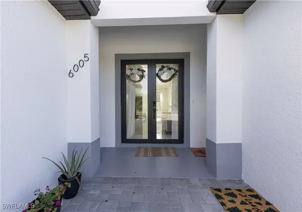 a view of a hallway with entryway of the house