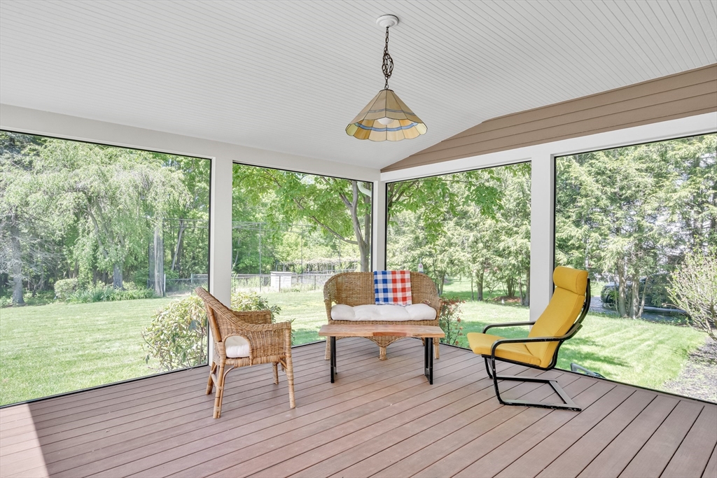 34 Solomon Pierce Road Lexington, MA 02420 - Photo 22 of 42 a living room with furniture and a floor to ceiling window
