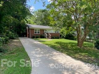 3921 Barlowe Road Charlotte, NC 28208 - Photo 2 of 2 a view of a house with a yard and tree