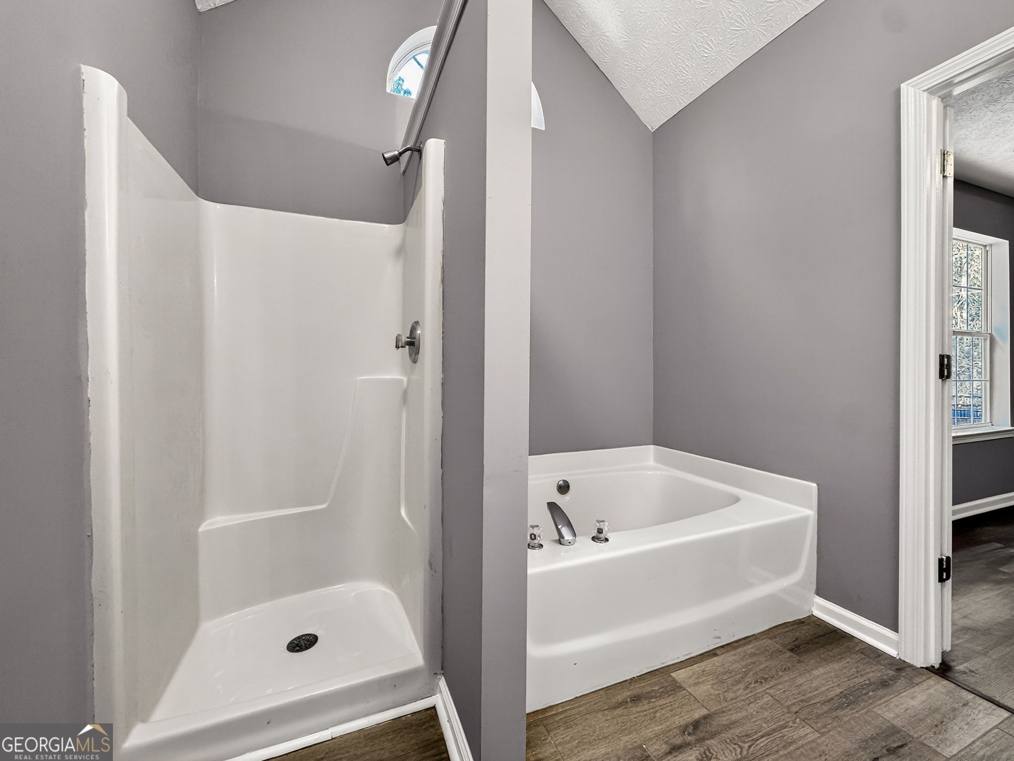 224 Stillwater Court Hampton, GA 30228 - Photo 13 of 44 a bathroom with a tub and shower