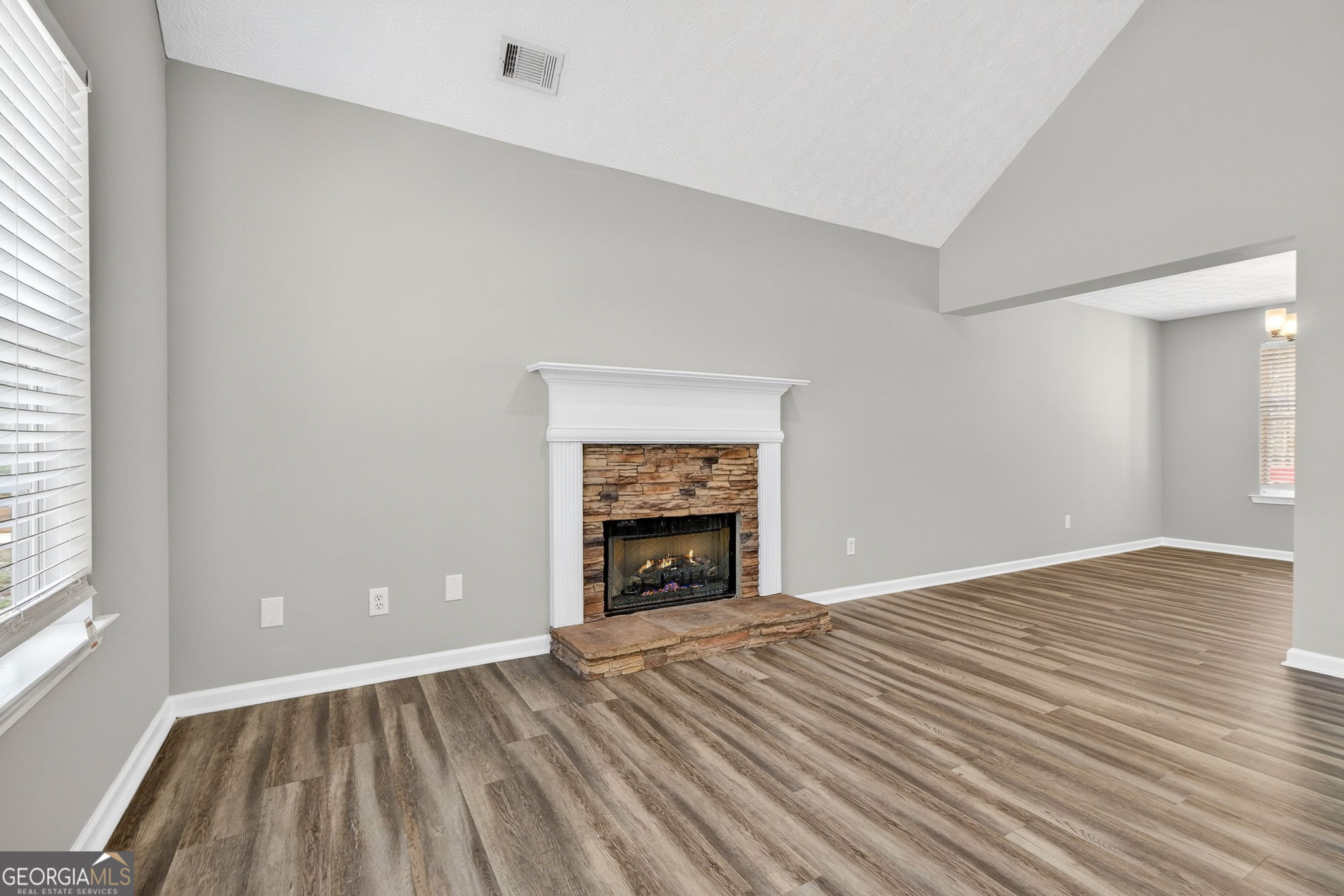 224 Stillwater Court Hampton, GA 30228 - Photo 18 of 44 a view of an empty room with window and fire place