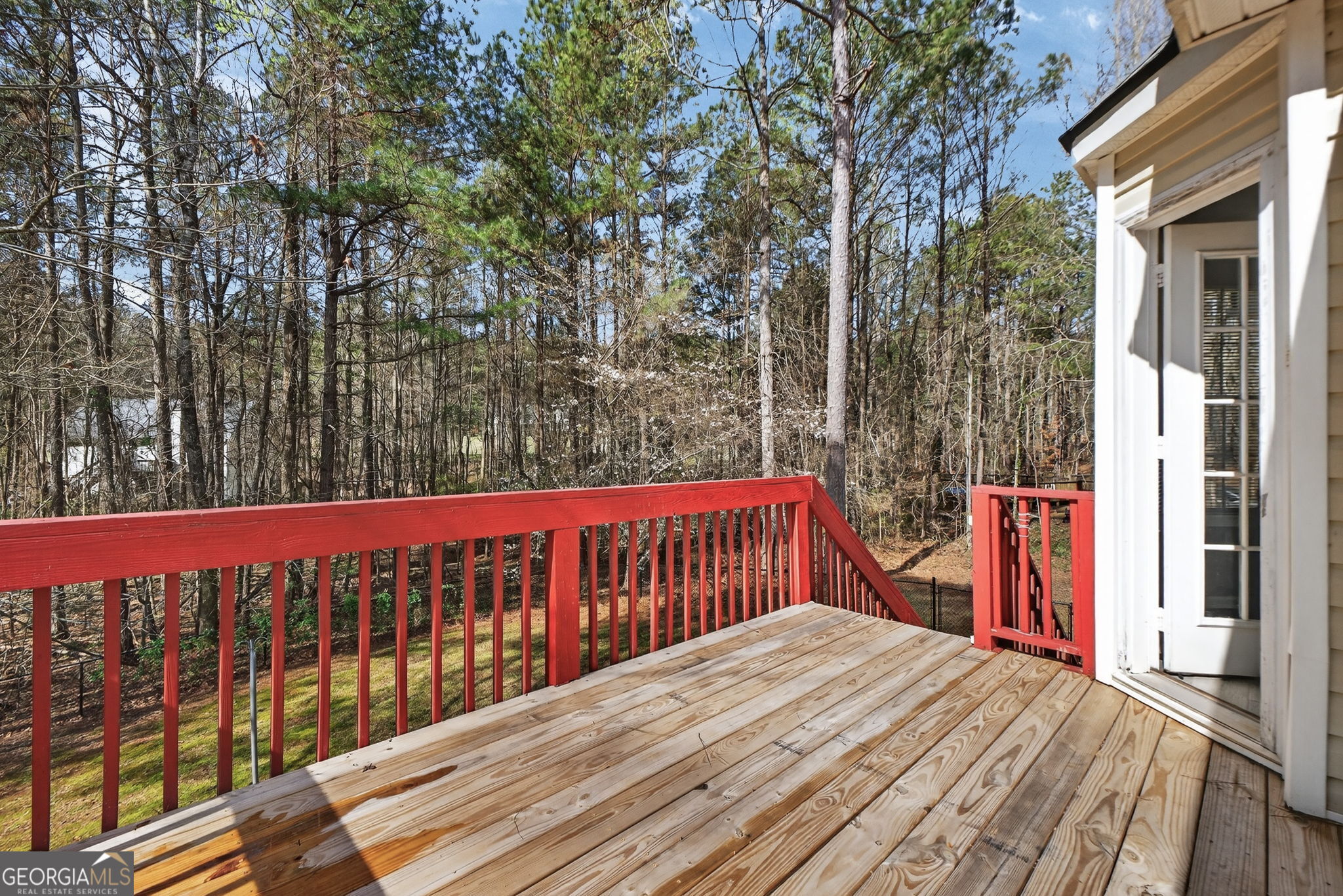 224 Stillwater Court Hampton, GA 30228 - Photo 23 of 44 a view of a wooden roof deck