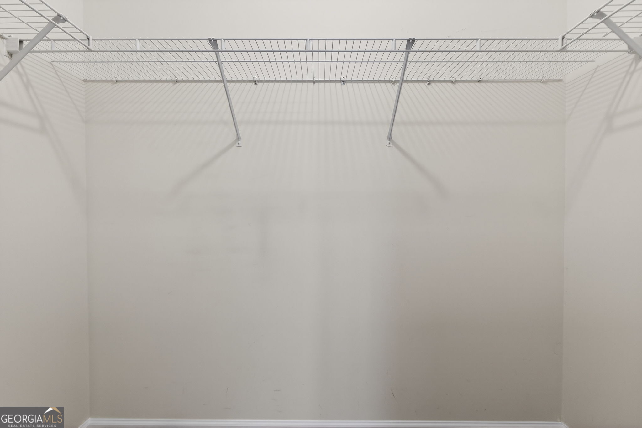 224 Stillwater Court Hampton, GA 30228 - Photo 24 of 44 a view of a room with racks on the wall