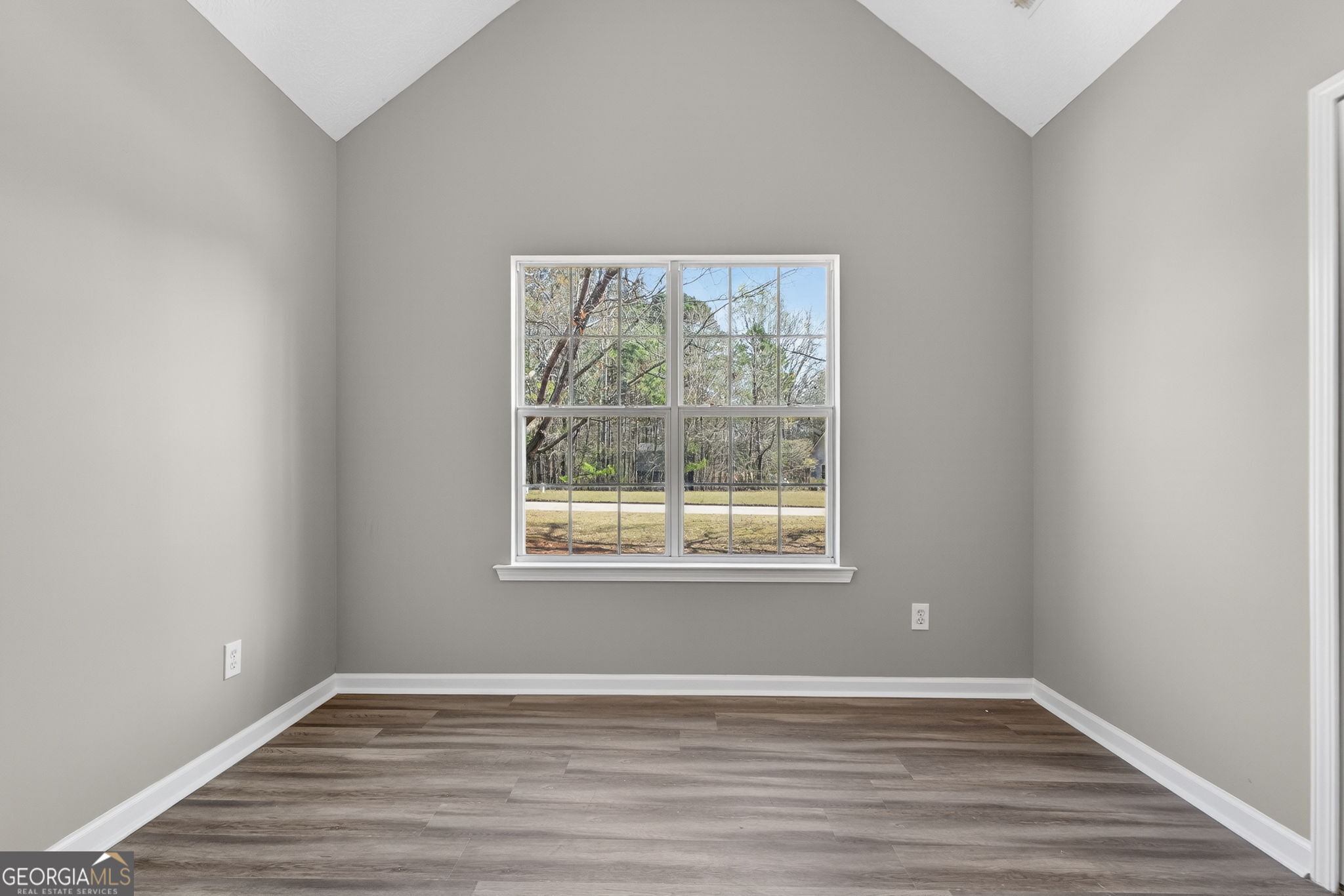 224 Stillwater Court Hampton, GA 30228 - Photo 26 of 44 an empty room with wooden floor and windows