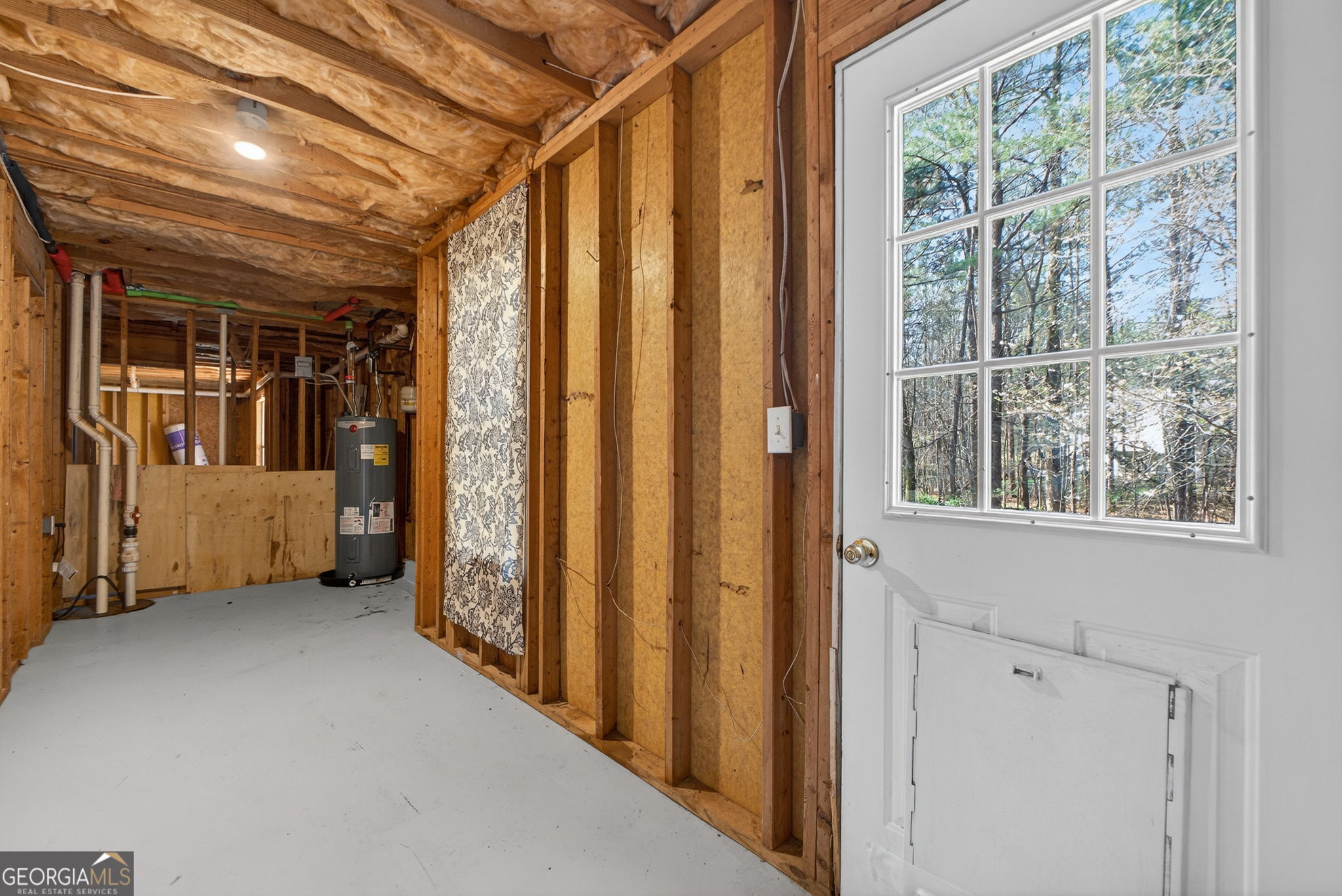 224 Stillwater Court Hampton, GA 30228 - Photo 37 of 44 a view of a hallway with wooden walls and windows