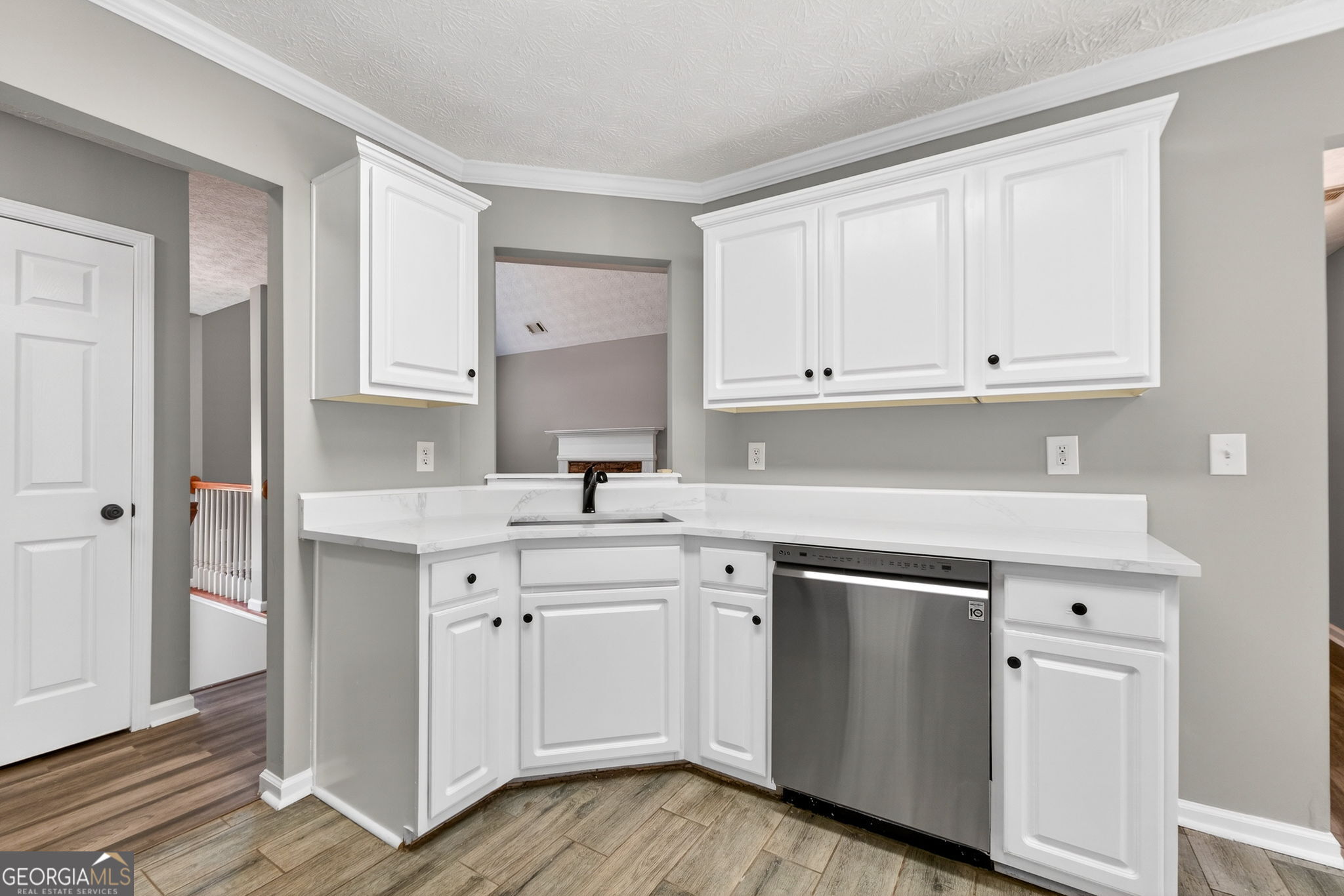 224 Stillwater Court Hampton, GA 30228 - Photo 7 of 44 a kitchen with white cabinets appliances and a sink