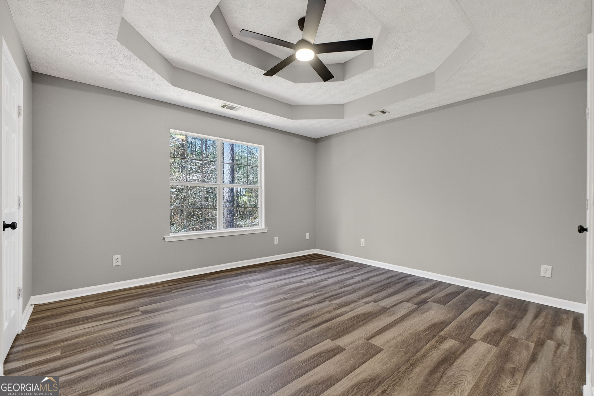 224 Stillwater Court Hampton, GA 30228 - Photo 9 of 44 wooden floor in an empty room with a window