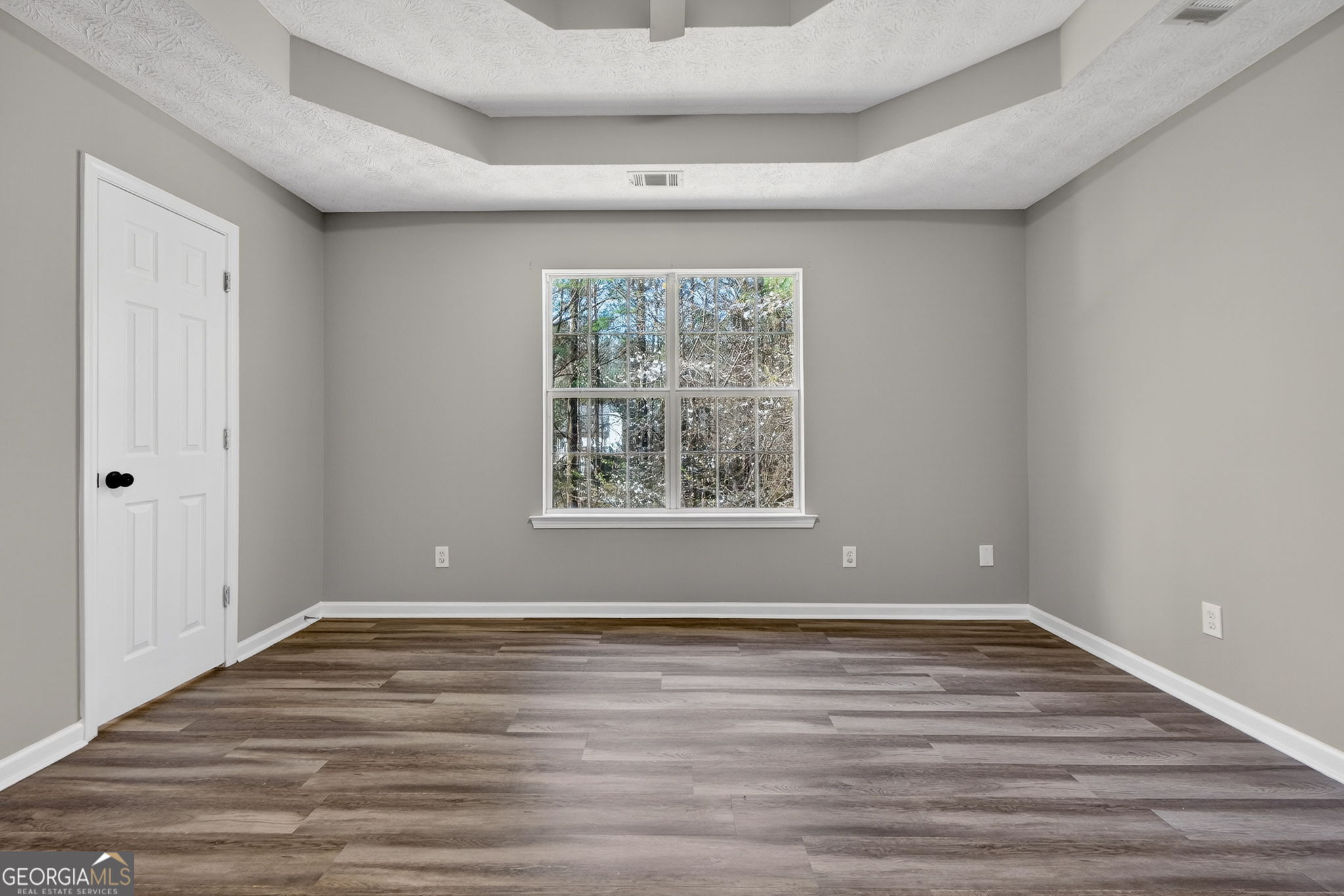 224 Stillwater Court Hampton, GA 30228 - Photo 10 of 44 wooden floor in an empty room with a window