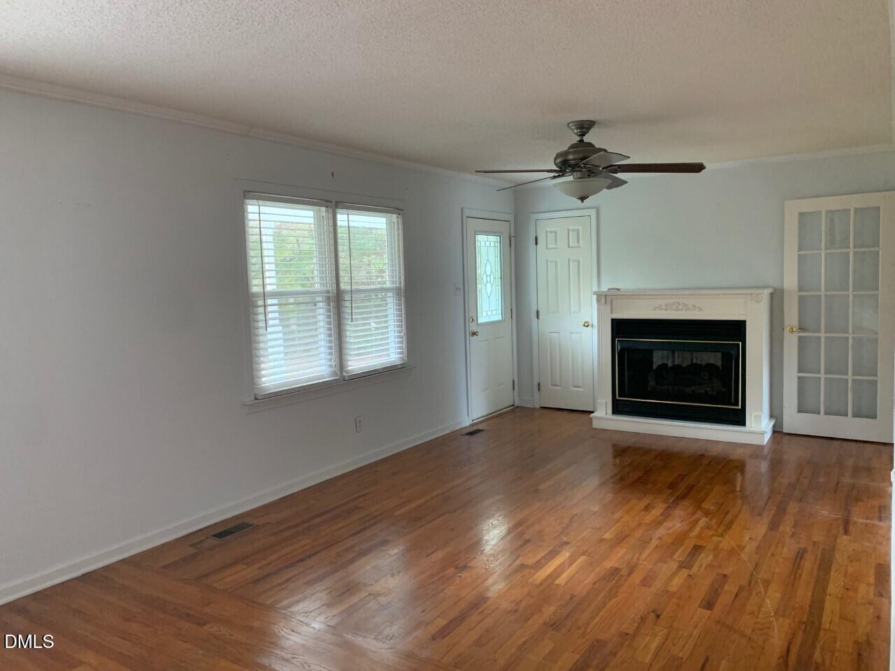 204 Shaw's Pond Road Four Oaks, NC 27524 - Photo 5 of 13 204 Shaws Pond Road Living Room fireplac