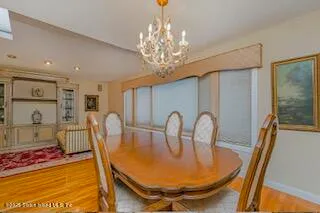 a bedroom with furniture and a chandelier