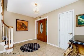 a view of a bedroom with bed and window