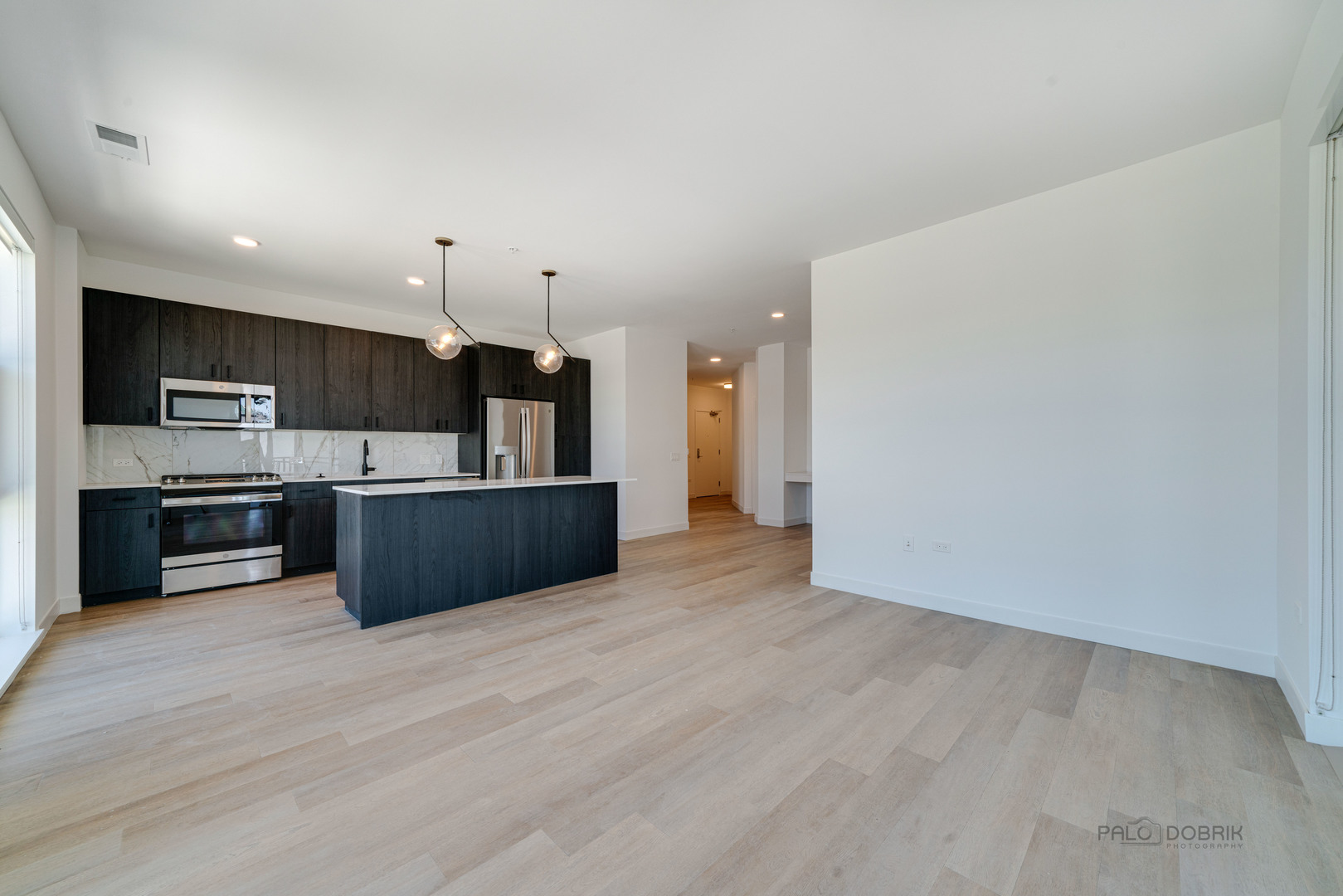 750 Hawthorn Row, Unit 4166 Vernon Hills, IL 60061 - Photo 14 of 24 a kitchen with stainless steel appliances a refrigerator and a sink