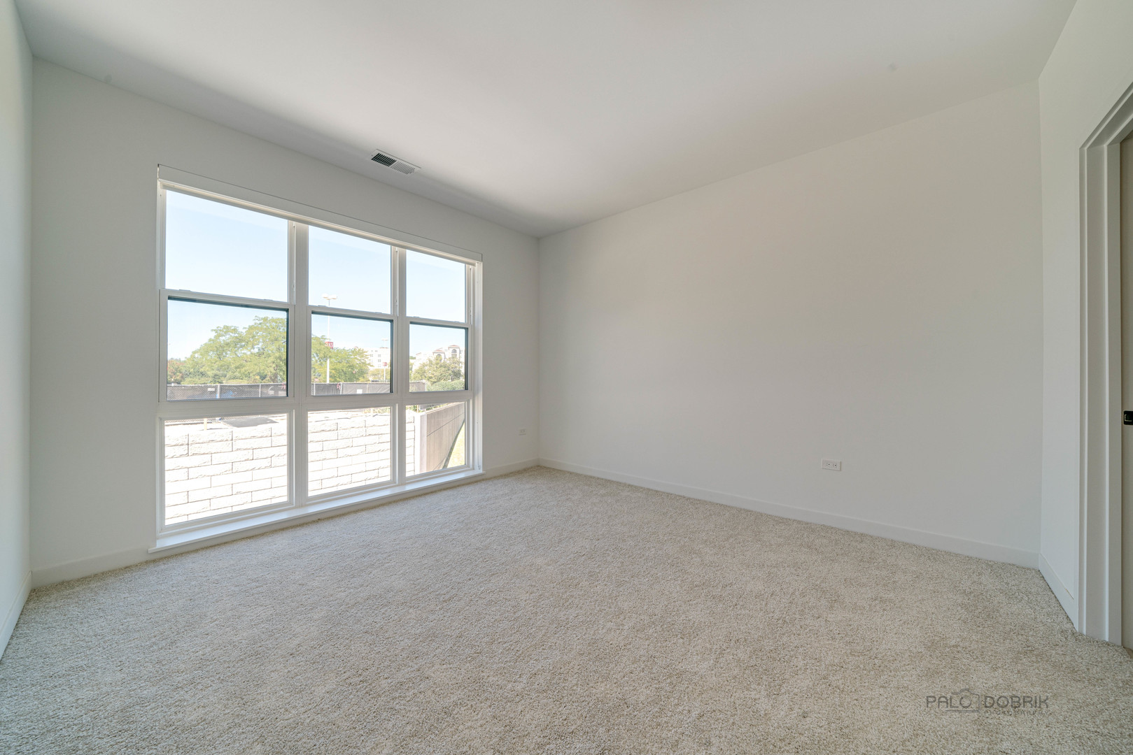 750 Hawthorn Row, Unit 4166 Vernon Hills, IL 60061 - Photo 15 of 24 an empty room with windows