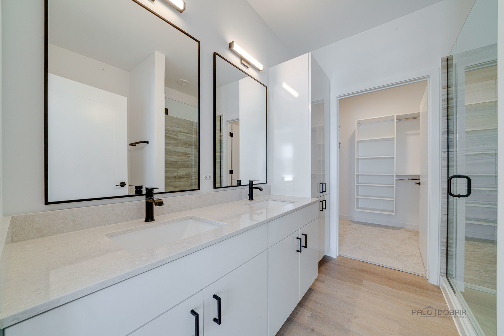 750 Hawthorn Row, Unit 4166 Vernon Hills, IL 60061 - Photo 17 of 24 a bathroom with a double vanity sink and mirror