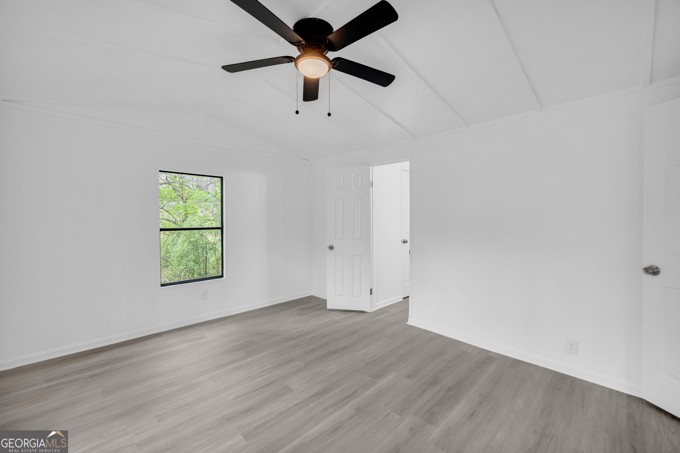 1144 Wolfskin Road Arnoldsville, GA 30619 - Photo 13 of 41 wooden floor in an empty room with a window