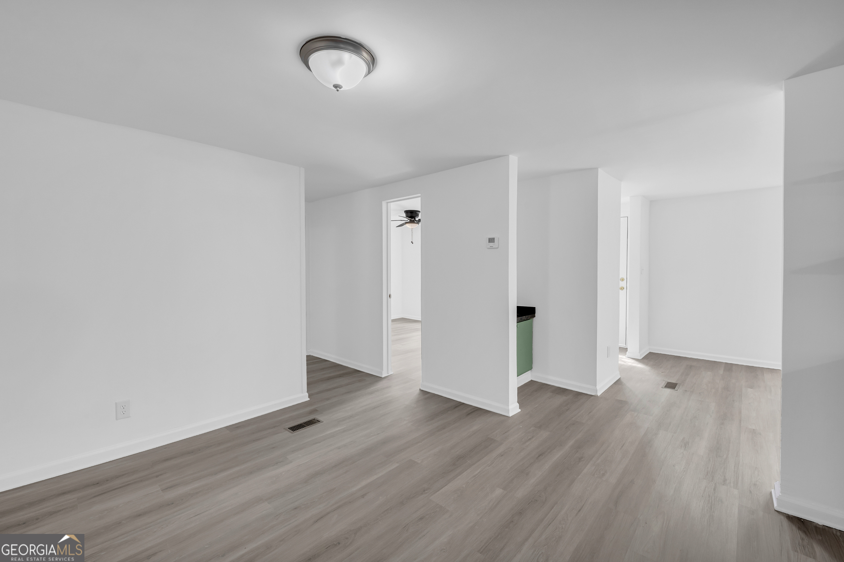 1144 Wolfskin Road Arnoldsville, GA 30619 - Photo 18 of 41 a view of an empty room with wooden floor
