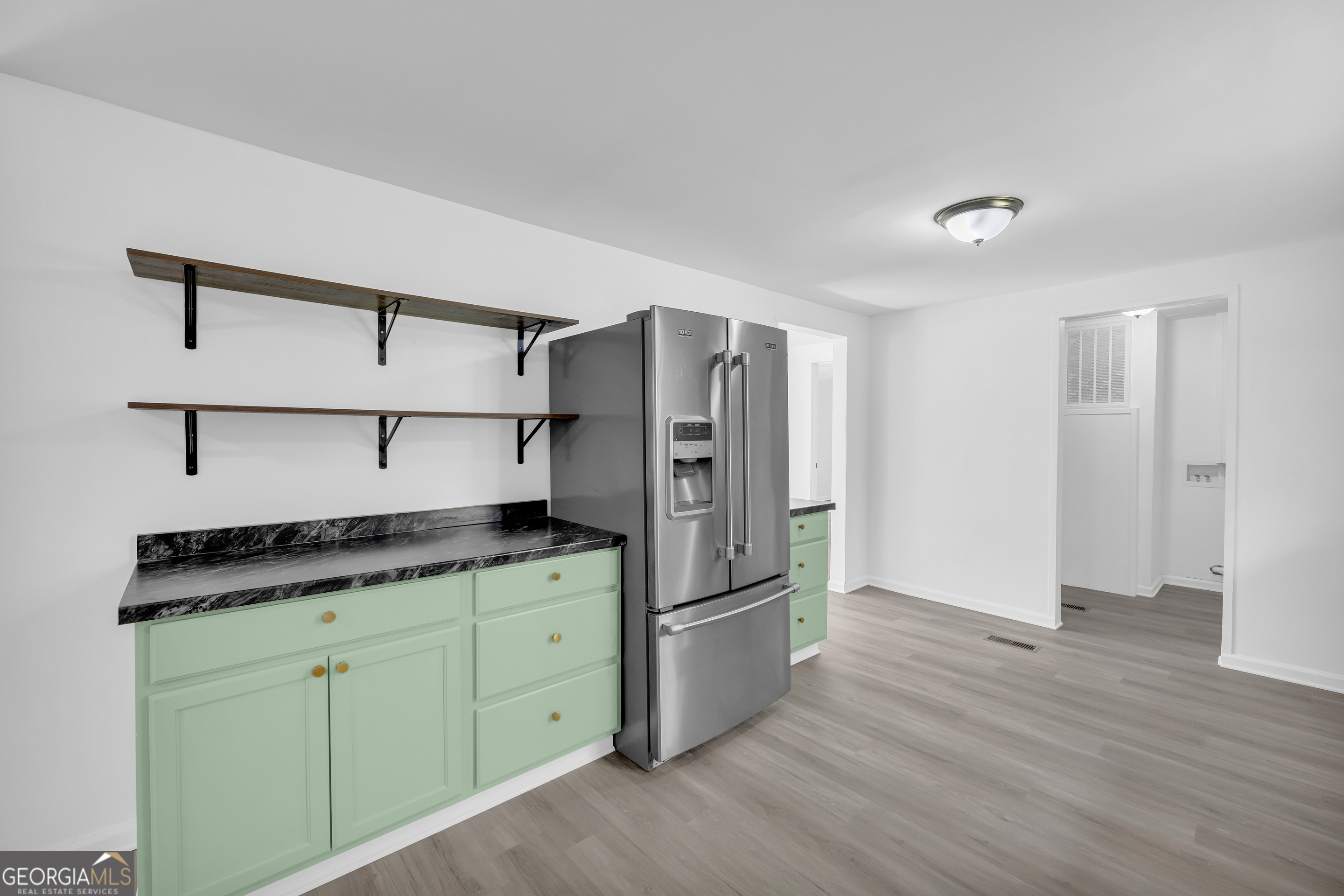 1144 Wolfskin Road Arnoldsville, GA 30619 - Photo 20 of 41 a kitchen with granite countertop a refrigerator and a sink