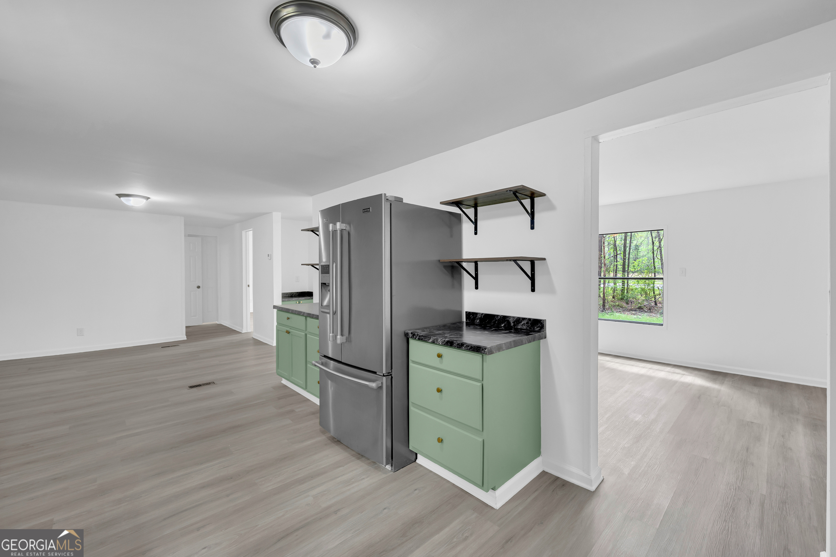 1144 Wolfskin Road Arnoldsville, GA 30619 - Photo 22 of 41 a kitchen with stainless steel appliances granite countertop a refrigerator and a sink