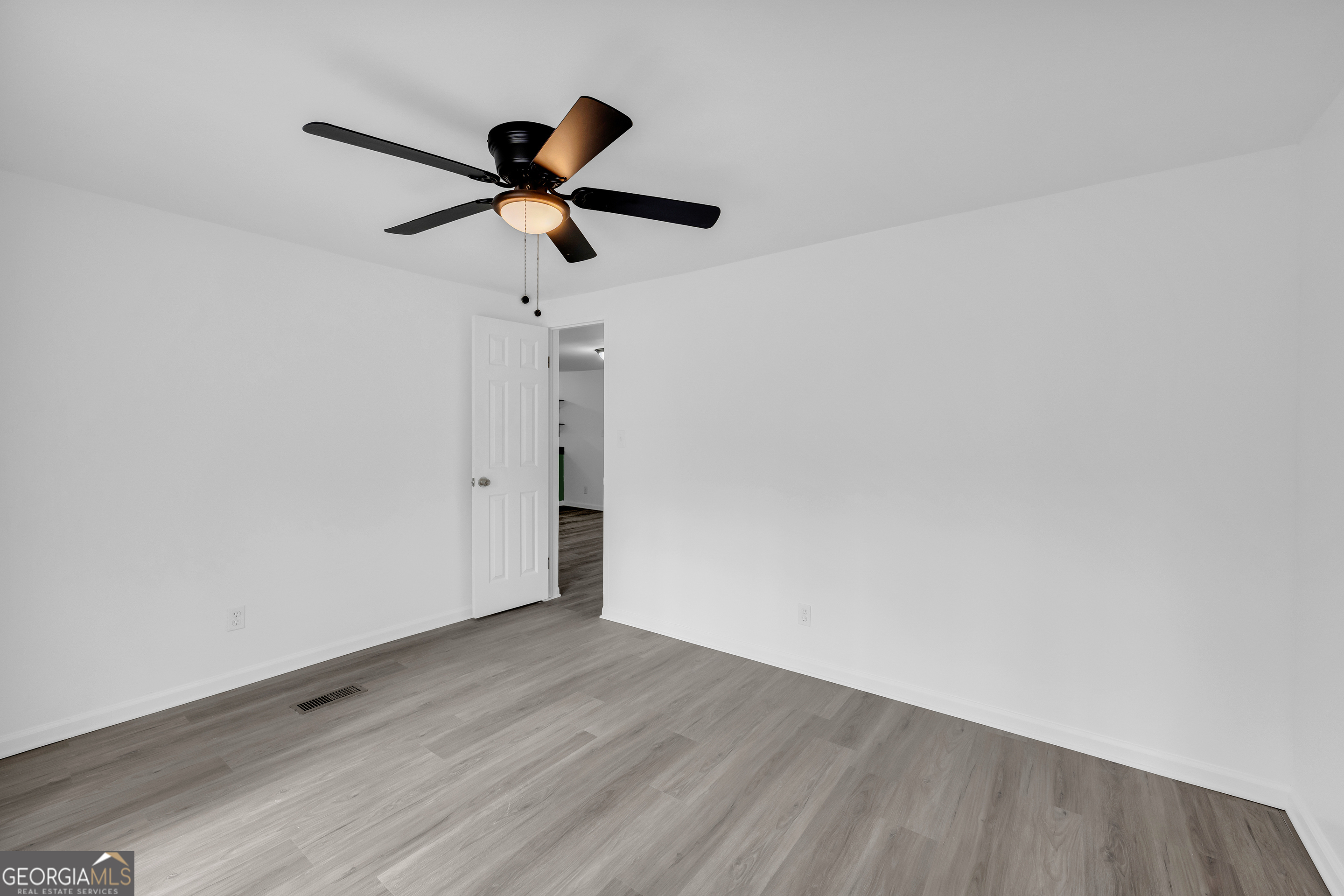 1144 Wolfskin Road Arnoldsville, GA 30619 - Photo 26 of 41 a view of empty room with wooden floor