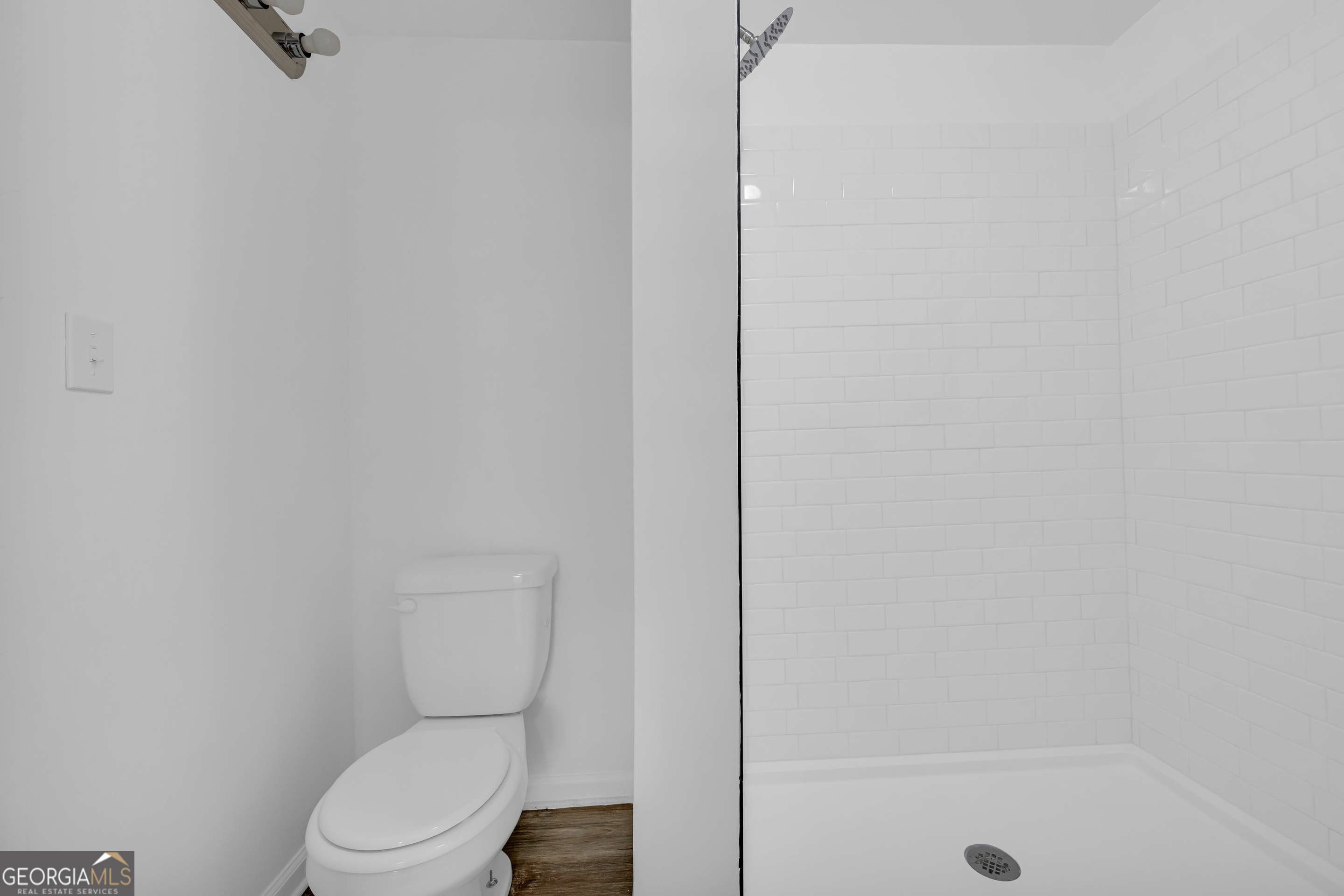 1144 Wolfskin Road Arnoldsville, GA 30619 - Photo 29 of 41 a white toilet sitting next to a bath tub