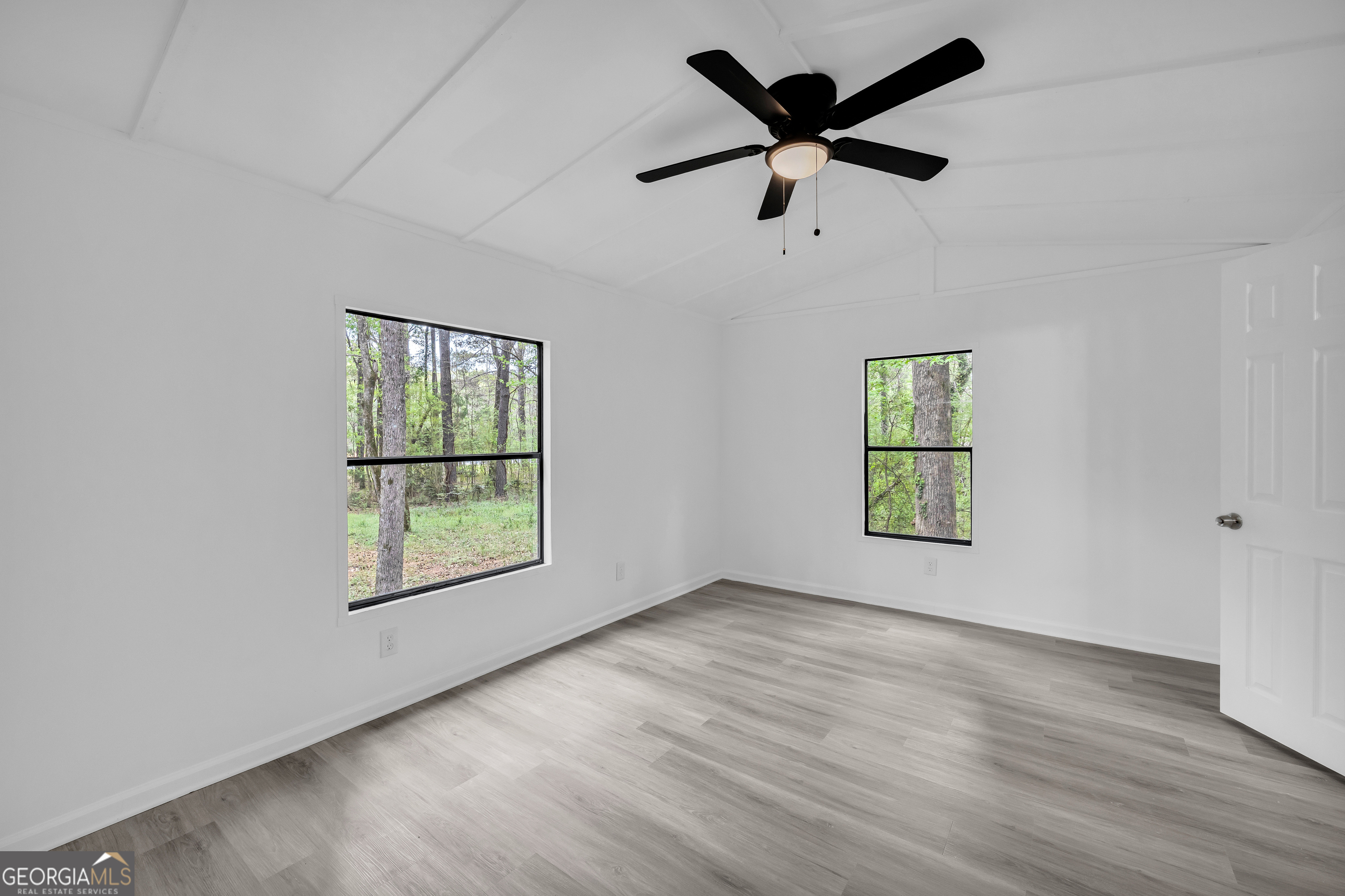 1144 Wolfskin Road Arnoldsville, GA 30619 - Photo 10 of 41 wooden floor in an empty room with a window