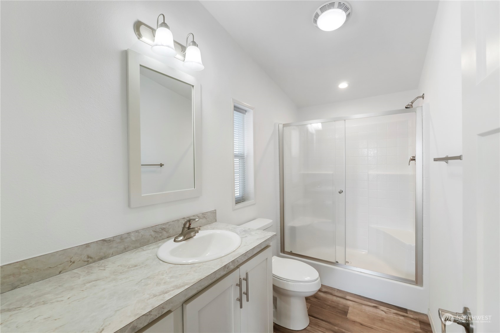 943 Pine Drive Enumclaw, WA 98022 - Photo 13 of 21 a bathroom with a granite countertop sink a toilet and shower