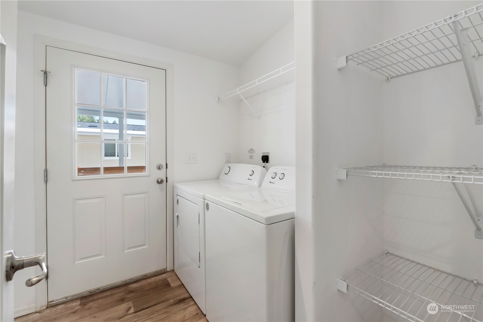 943 Pine Drive Enumclaw, WA 98022 - Photo 17 of 21 a utility room with cabinets washer and dryer