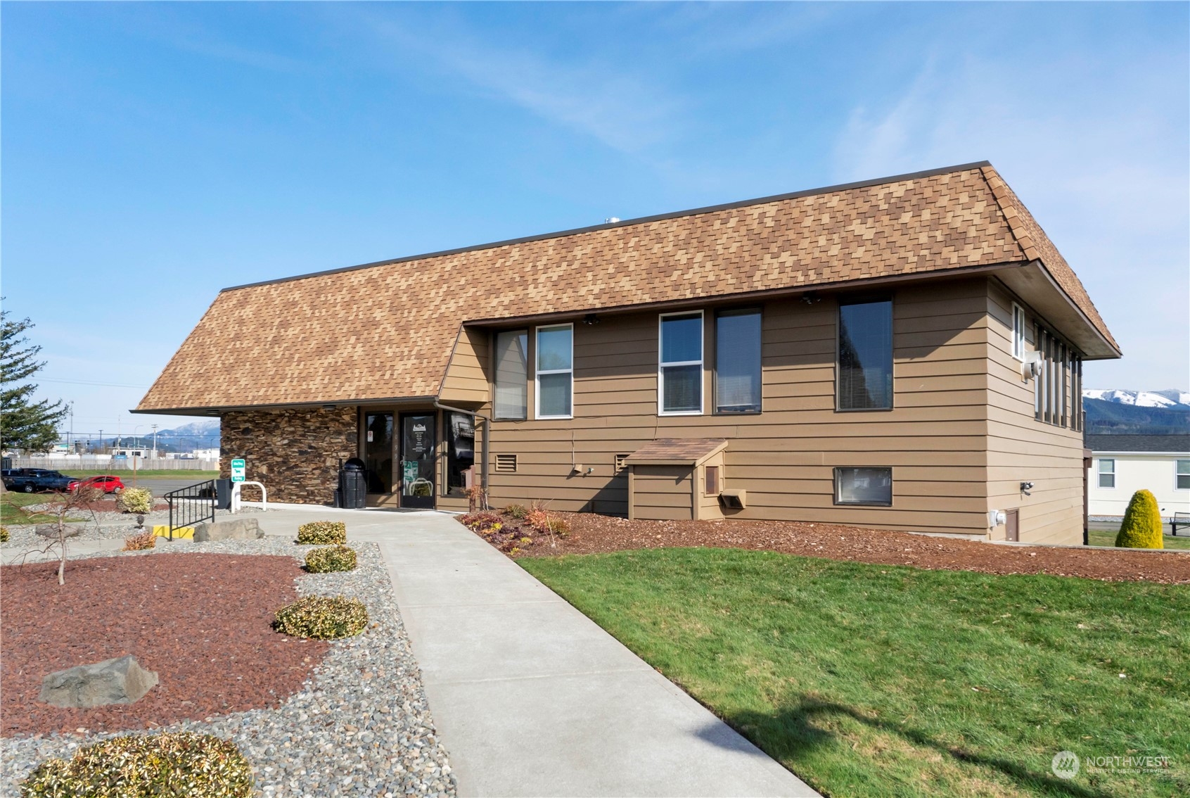 943 Pine Drive Enumclaw, WA 98022 - Photo 19 of 21 a front view of a house with garden