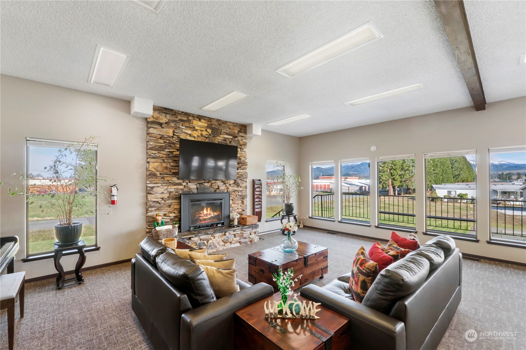 943 Pine Drive Enumclaw, WA 98022 - Photo 21 of 21 a living room with furniture and a floor to ceiling window