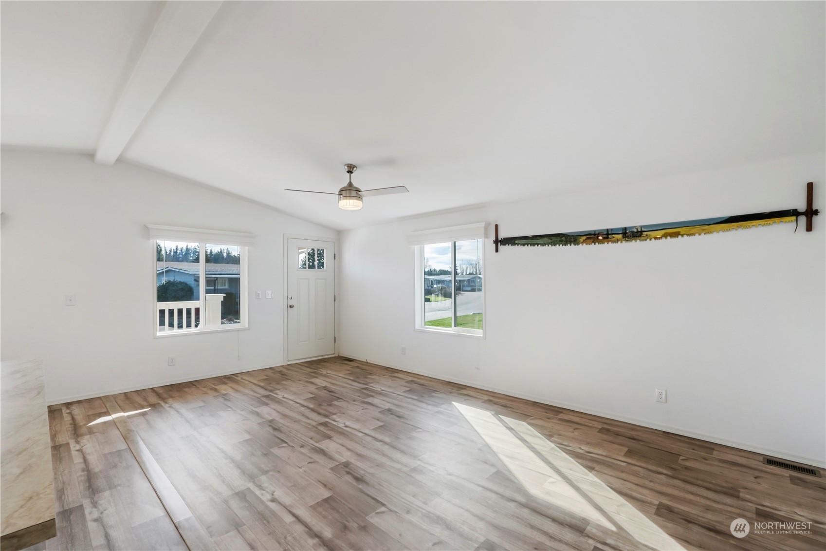943 Pine Drive Enumclaw, WA 98022 - Photo 6 of 21 wooden floor in an empty room with a window