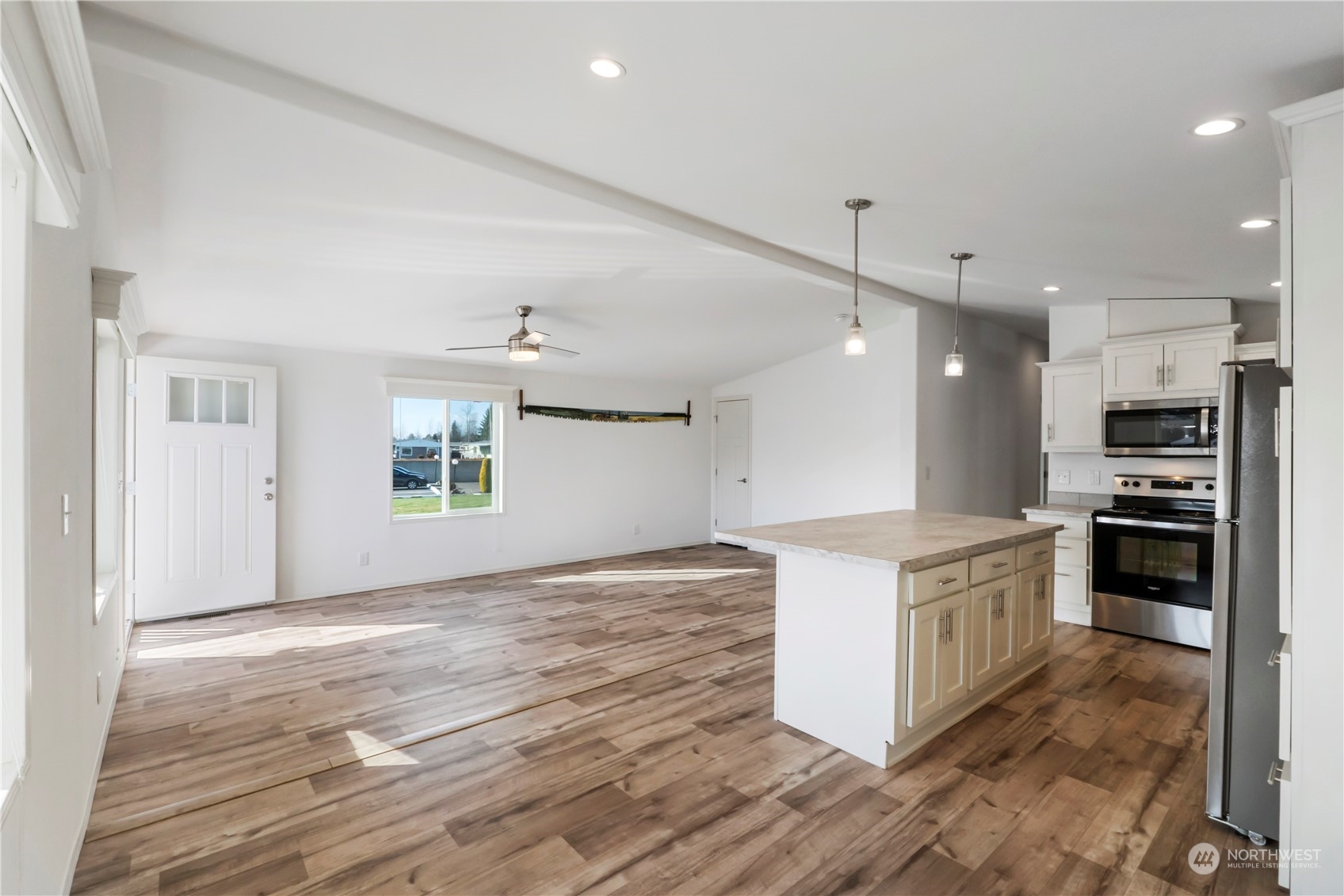 943 Pine Drive Enumclaw, WA 98022 - Photo 10 of 21 a kitchen with stainless steel appliances granite countertop a stove and a refrigerator
