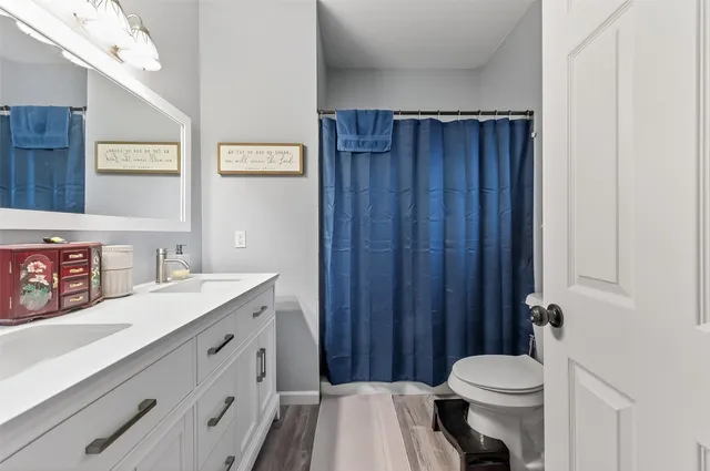 a bathroom with a sink vanity and a mirror