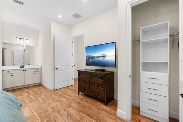 a room with furniture and wooden floor