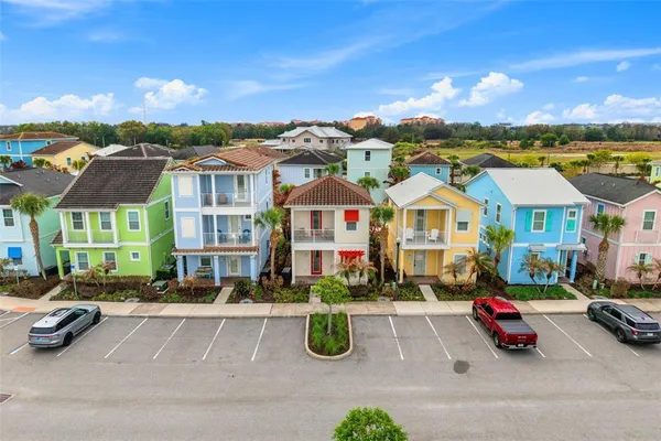 a view of multiple houses with a swimming pool