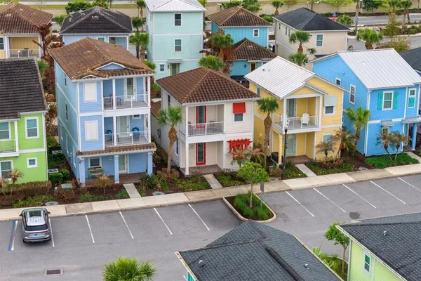 a front view of a residential apartment building with a yard