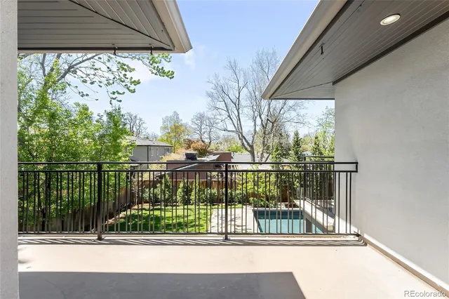 a spacious bathroom with a granite countertop sink and a bathtub