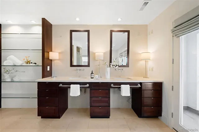 a bedroom with a large bed and a large window