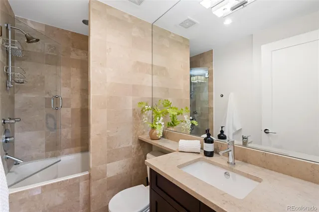 a spacious bedroom with a large bed and a window