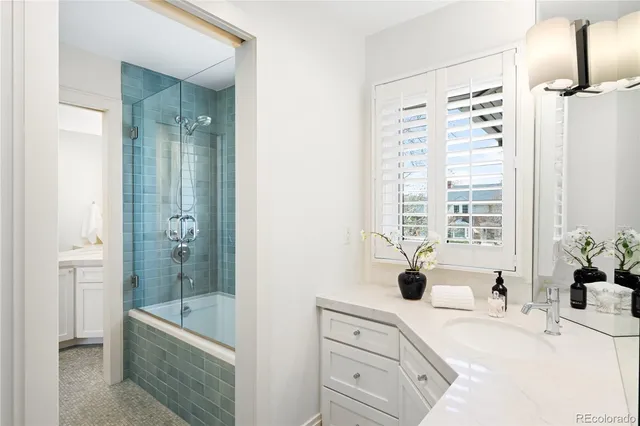 a bathroom with a bathtub and shower