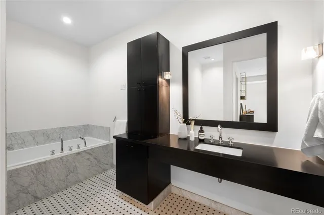 a view of bathroom with bathtub and shower