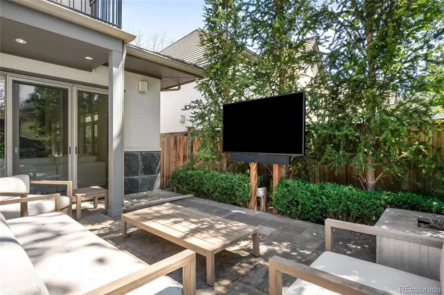 a view of a house with a yard patio and sitting area