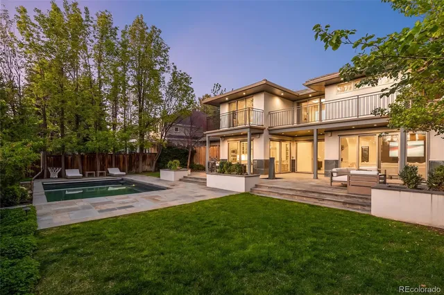 a view of a swimming pool with sitting area