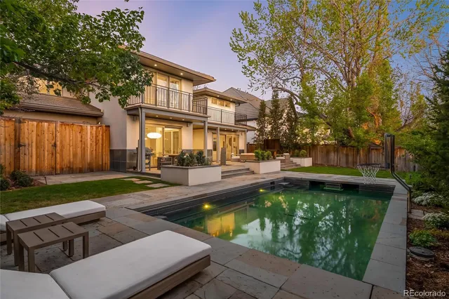 an aerial view of a house with a mountain