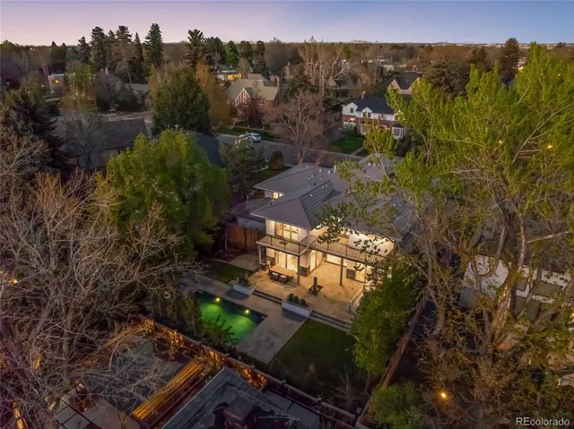 a front view of a house with a yard with plants