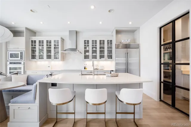 a kitchen with stainless steel appliances granite countertop a sink and stove