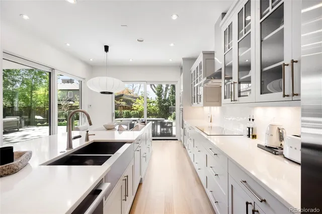 a large kitchen with stainless steel appliances a lot of counter space and a large window