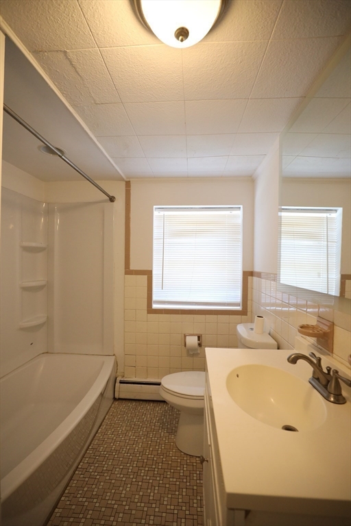 45 Assunta Road Revere, MA 02151 - Photo 13 of 19 a bathroom with a sink a toilet and bathtub